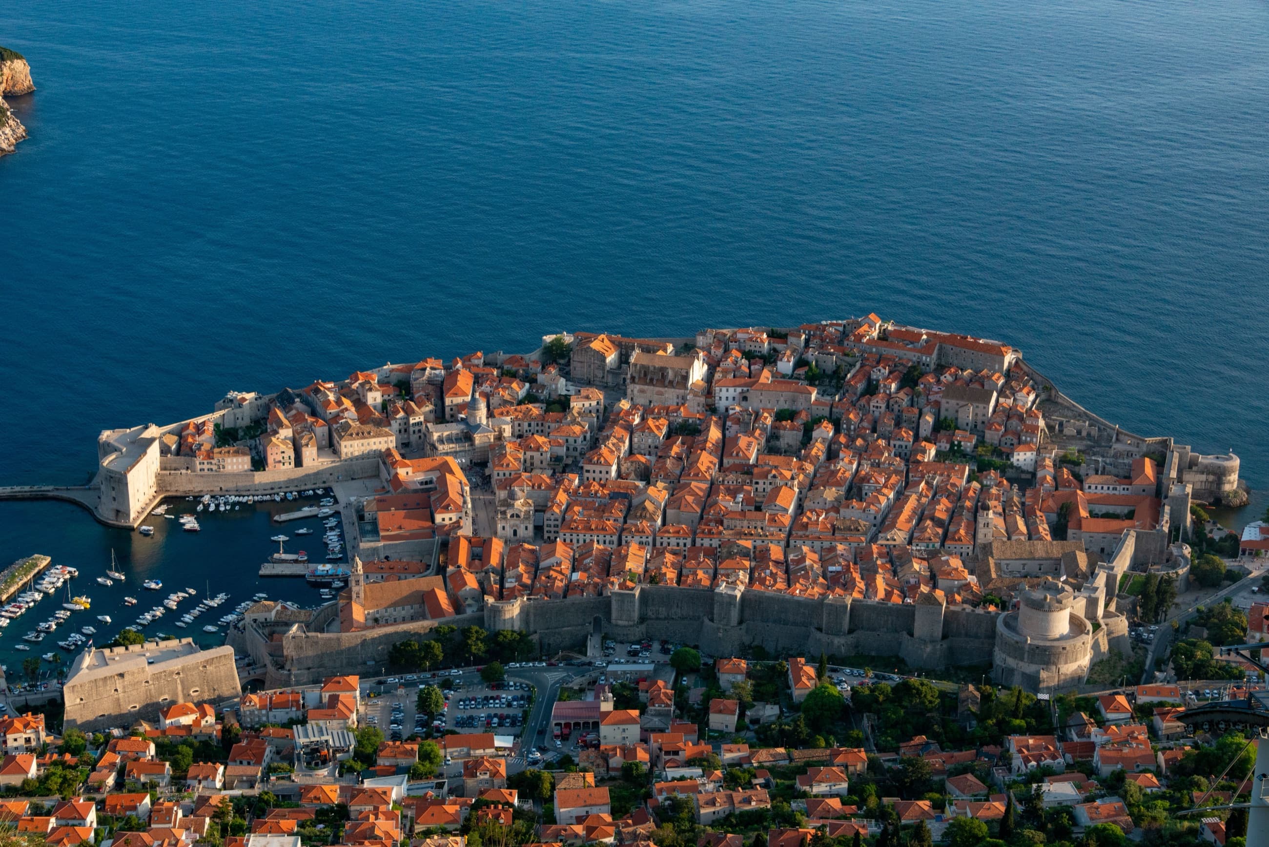 Aerial view of Dubrovnik Old Town and its walls at golden hour